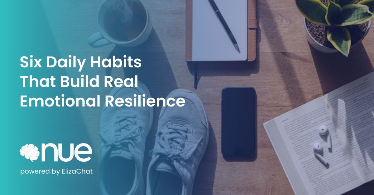 Running shoes, a notebook and a phone on a table